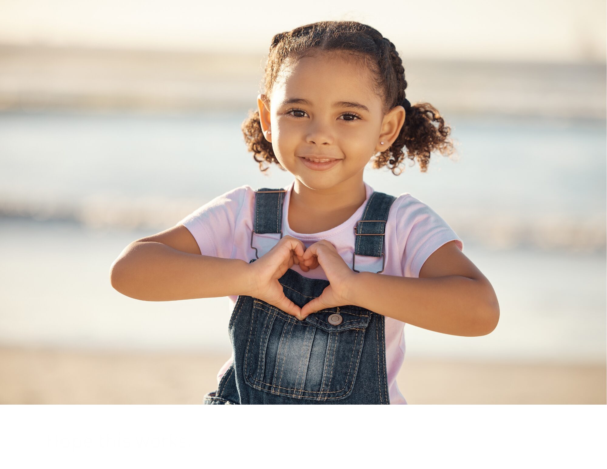 Girl making a heart shape with her hands